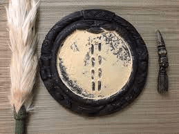 An Ifa divination tray — symbolic and meaningful to the initiated, magical to the unschooled.